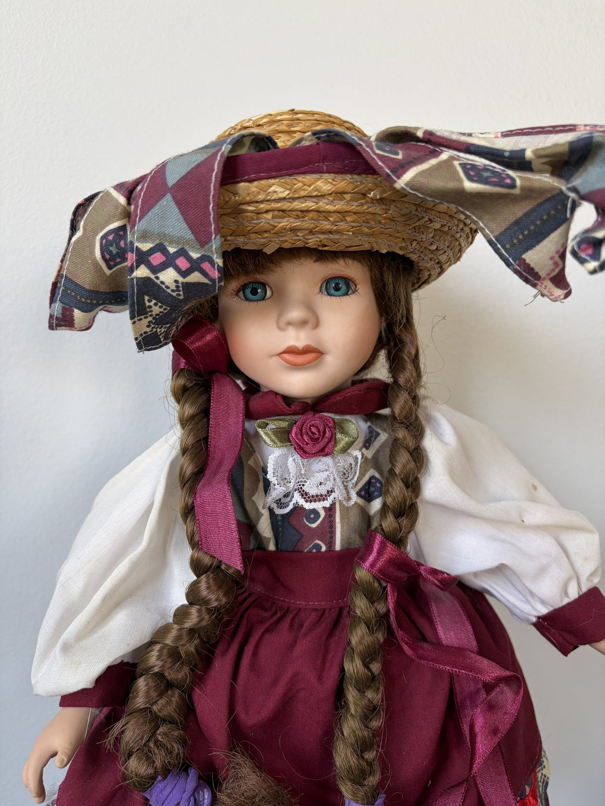 Heritage Mint Porcelain Doll with Braided Hair and Hat