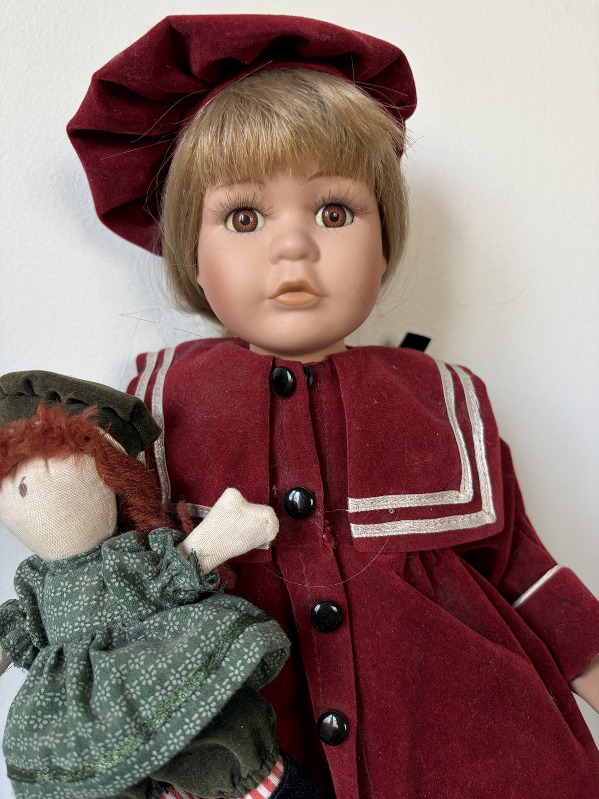 Porcelain Doll in Burgundy Outfit with Doll Accessory