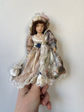 Vintage Porcelain Doll Collection in Victorian Dresses with Lace and Hats