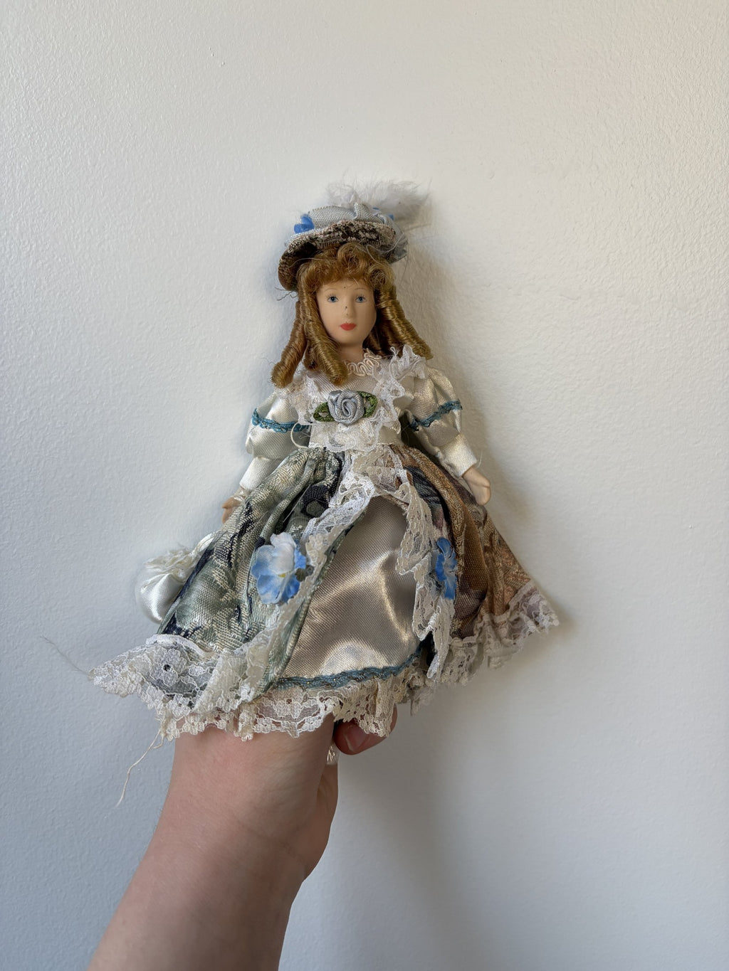 Vintage Porcelain Doll Collection in Victorian Dresses with Lace and Hats