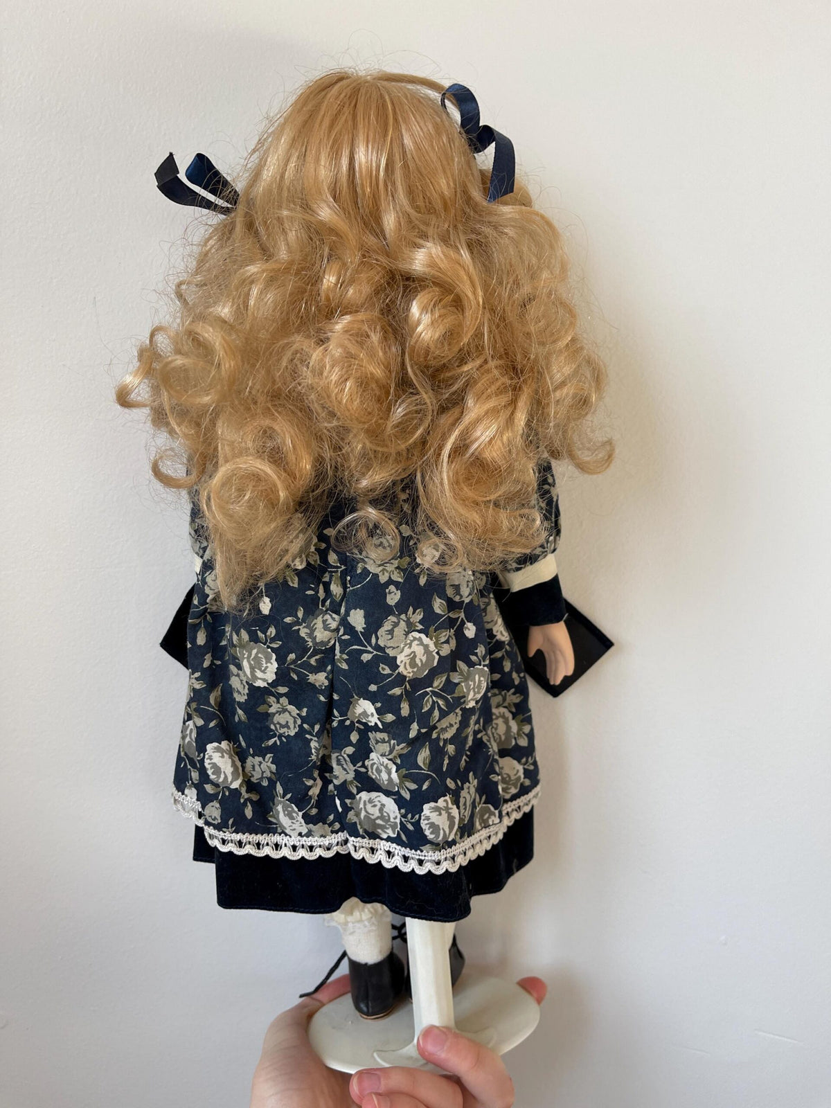 Vintage Porcelain Doll — Navy Floral Dress with Velvet Bow