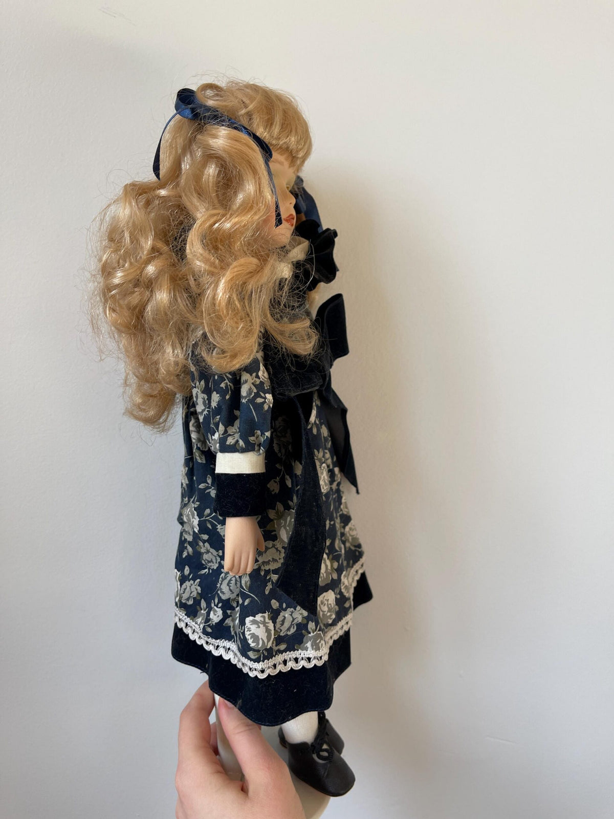 Vintage Porcelain Doll — Navy Floral Dress with Velvet Bow