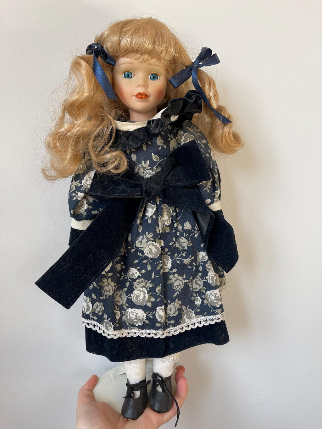 Vintage Porcelain Doll — Navy Floral Dress with Velvet Bow