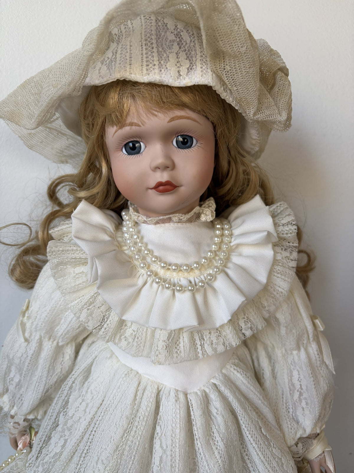 Vintage Porcelain Doll in Ivory Lace Dress with Blonde Curls