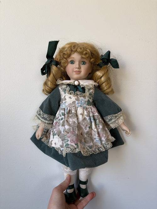 Blonde Curly Hair Porcelain Doll in Green Floral Dress 16″