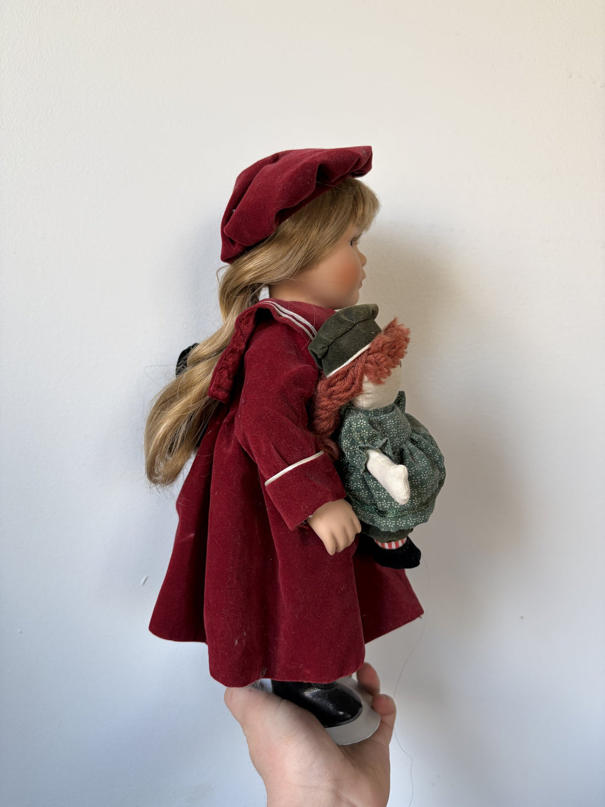 Porcelain Doll in Burgundy Outfit with Doll Accessory