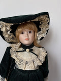 Ave Maria Porcelain Doll with Green Velvet Dress and Lace Trim